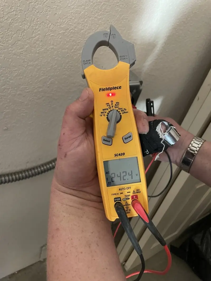 Voltage testing with clamp meter during Recessed Lighting Installation in Willows